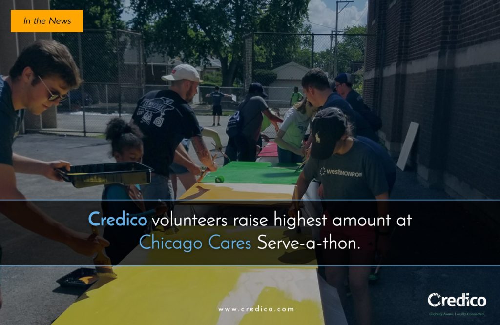 Credico volunteers prepare to paint at Foster Park school during the 2017 Chicago Cares Serve-a-thon