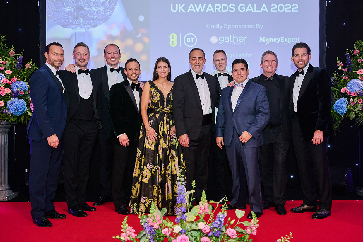 Credico's Chairman Antoine Nohra poses with National Consultants on stage at the 2022 UK Business Awards in London