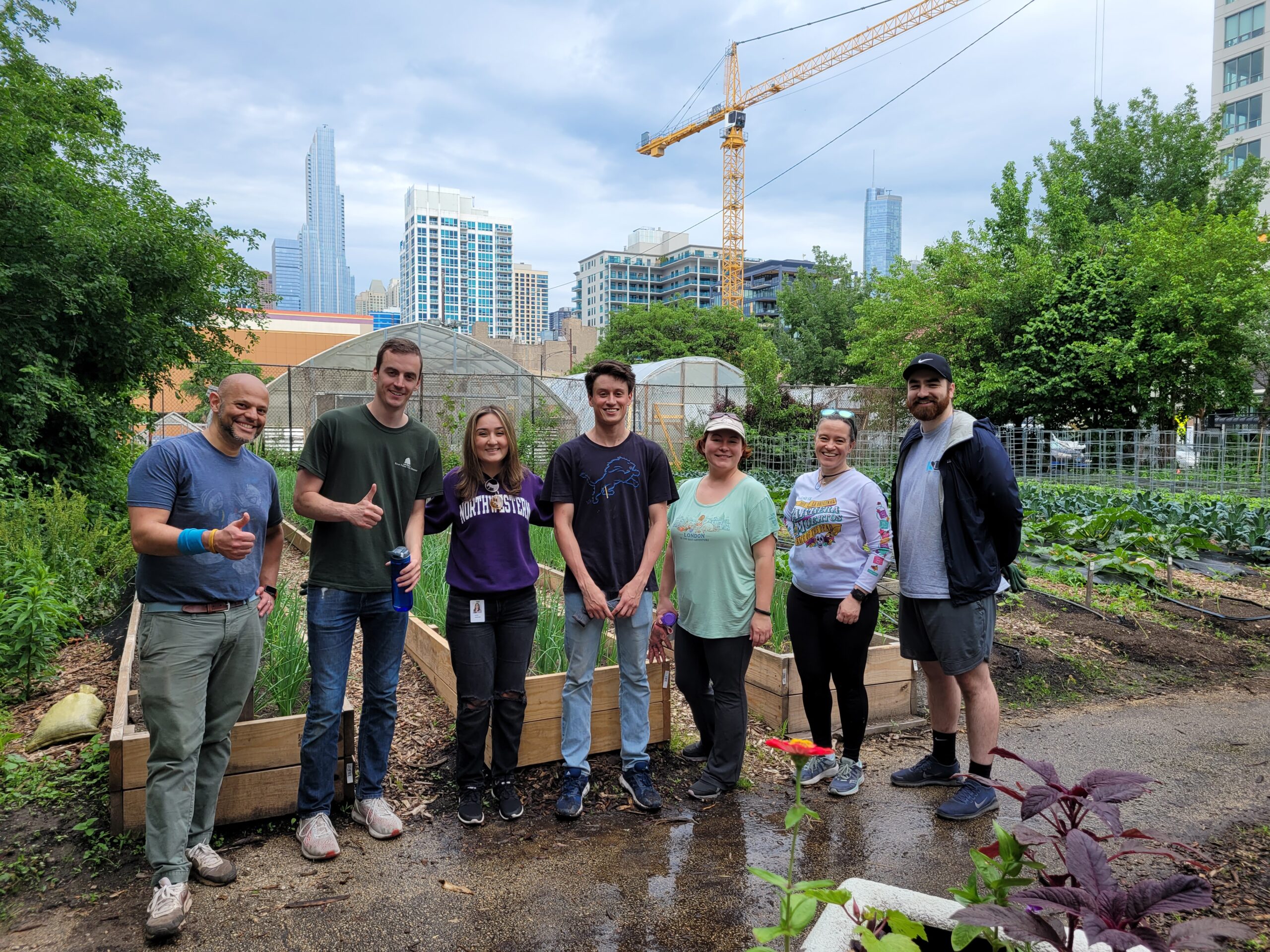 Credico volunteers pose for a photo after volunteering at Chicago Lights Urban farm