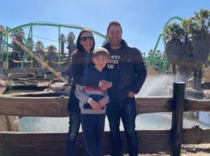 Credico South Africa's General Manager, Theuns Bezuidenhout, poses with his family at the Gold Reef City Theme Park for the 2022 Christmas in July outing