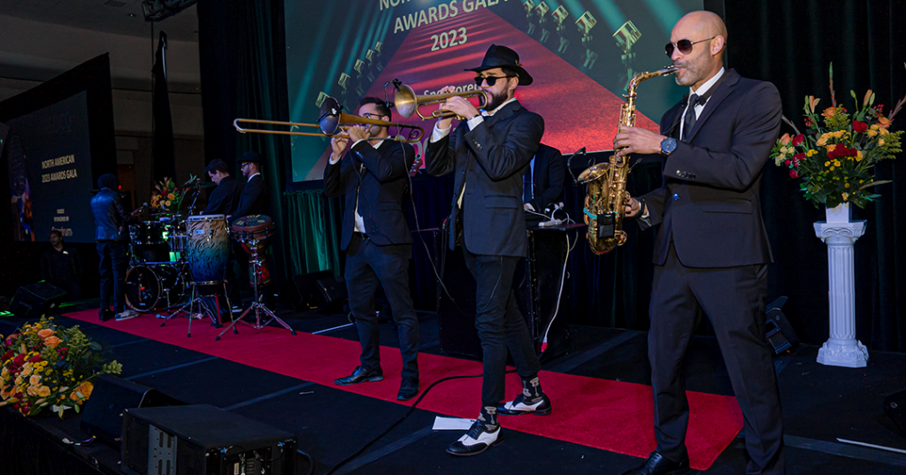 The horn section of the dinner band on stage at the January 2023 North American Awards Gala in Miami, Florida