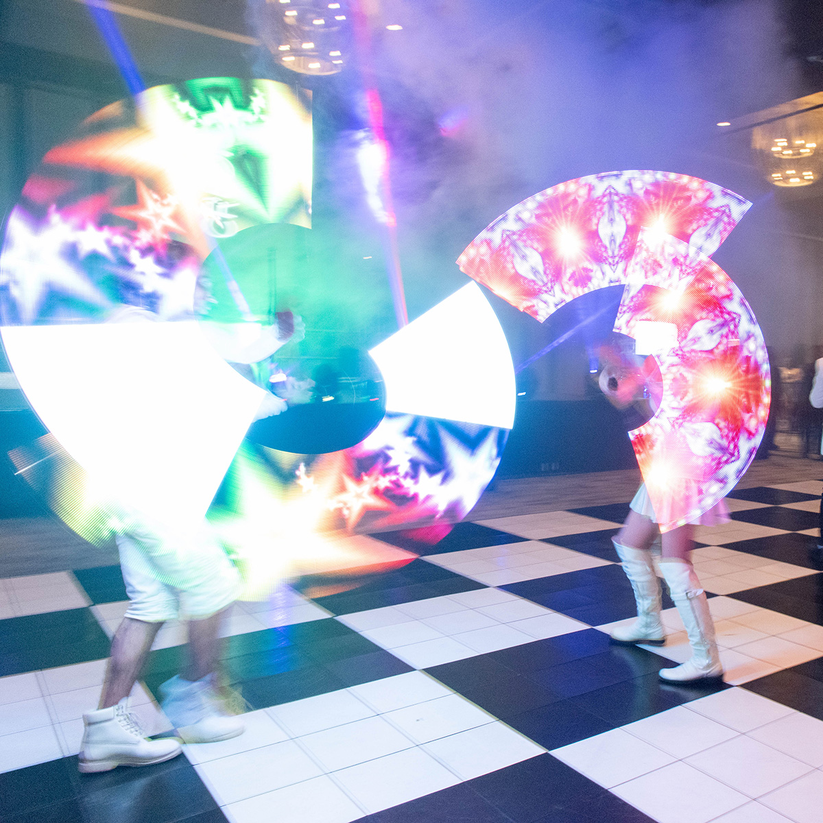 Dancers spin vivid LED lights on the dance floor at the celebration following Credico South Africa's 2023 Awards Gala at Sun City Resort