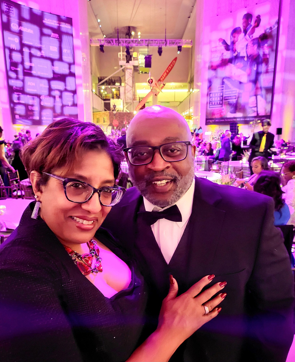 Susan Shields, Account Manager at Credico (USA) LLC, poses with her husband before dinner at the 2024 Black Creativity Gala at Chicago's Museum of Science and Industry