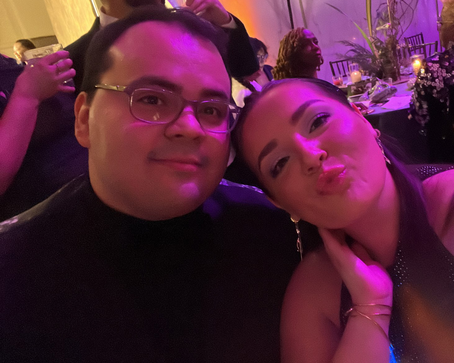 Anthony Morales, Account Executive, and Machaela DeSano, Account Manager, pose for a selfie at dinner at the 2024 Black Creativity Gala at Chicago's Museum of Science and Industry