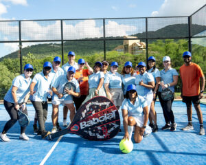 A happy group of competitors pose for a photo together on a padel court before the South Africa Awards Gala in March 2025