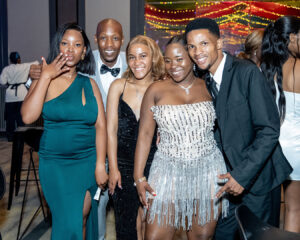 A group of attendees poses for a photo during the celebration following the South Africa Awards Gala in March 2025